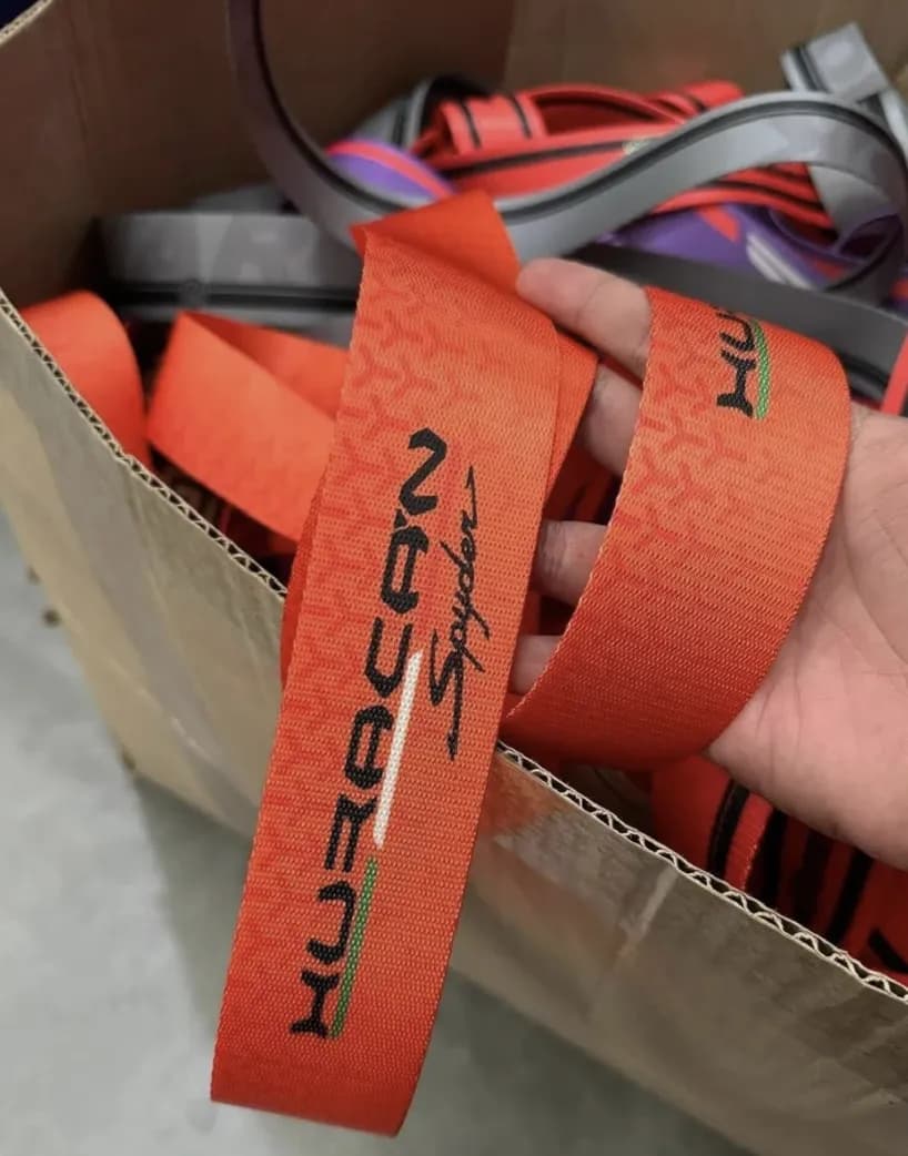 Custom Lamborghini Huracán Spyder seatbelt webbing in orange