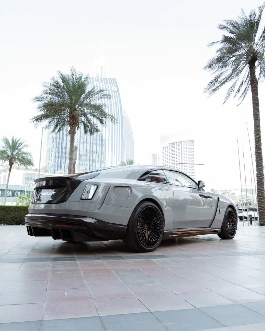 Gray Rolls-Royce Spectre with Venuum body kit and orange interior accents, photographed in Dubai (22)