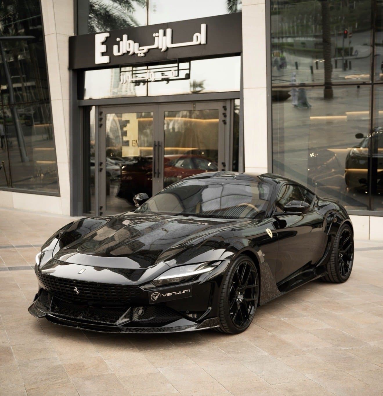 Black Ferrari Roma fitted with the Venuum body kit in the showroom (01)